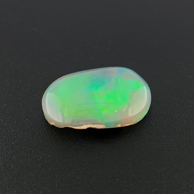 Solid Black Opal Freeform Oval Shape 1.51ct  Rolling Flash