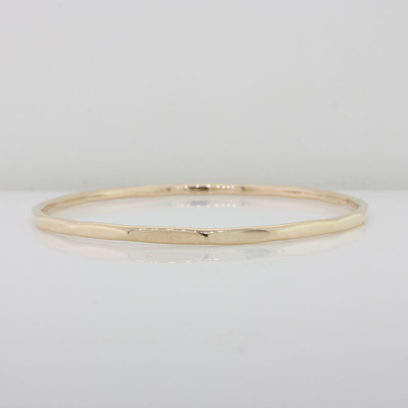 9 Carat Yellow Gold 64mm Internal Diameter, 2.91mm Wide, 2.48mm Thick, 11.89 grams Handmade Faceted Bangle