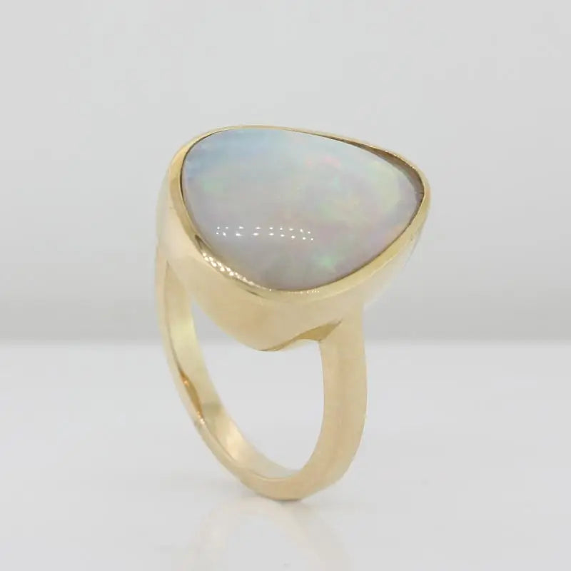 14 Carat Yellow Gold Bezel Set Freeform Pear Shape Solid Crystal Opal (3.46 Carat) Ring Size N