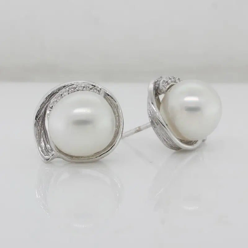 18 carat White Gold Diamond 14=0.07ct H/SI Pave Swirl Studs with 10-10.5mm Sth Sea Pearls A+