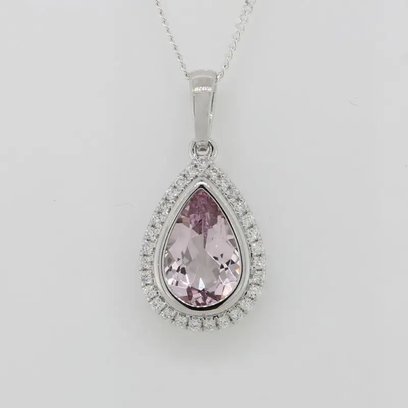 18 Carat White Gold Pear Shaped Morganite 1.15 Carat With Diamond Halo TDW = 0.10 Carat Pendant