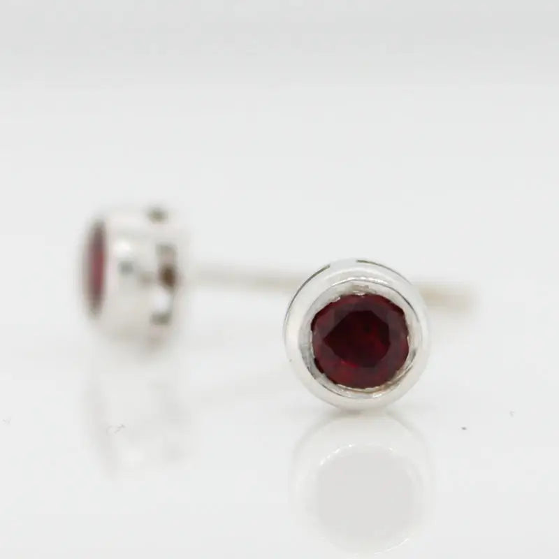 18 Carat White Gold Ruby Bezel Set Stud Earrings