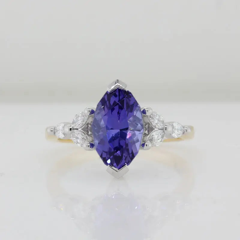 18 Carat Yellow and White Gold Marquise cut Tanzanite and Marquise Diamond Ring 