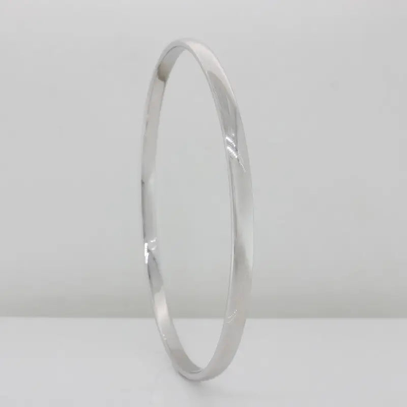 9 Carat White Gold Handmade Solid, Low Round Bangle, 16.40 Grams, 3.90mm Wide, 1.90mm Thick