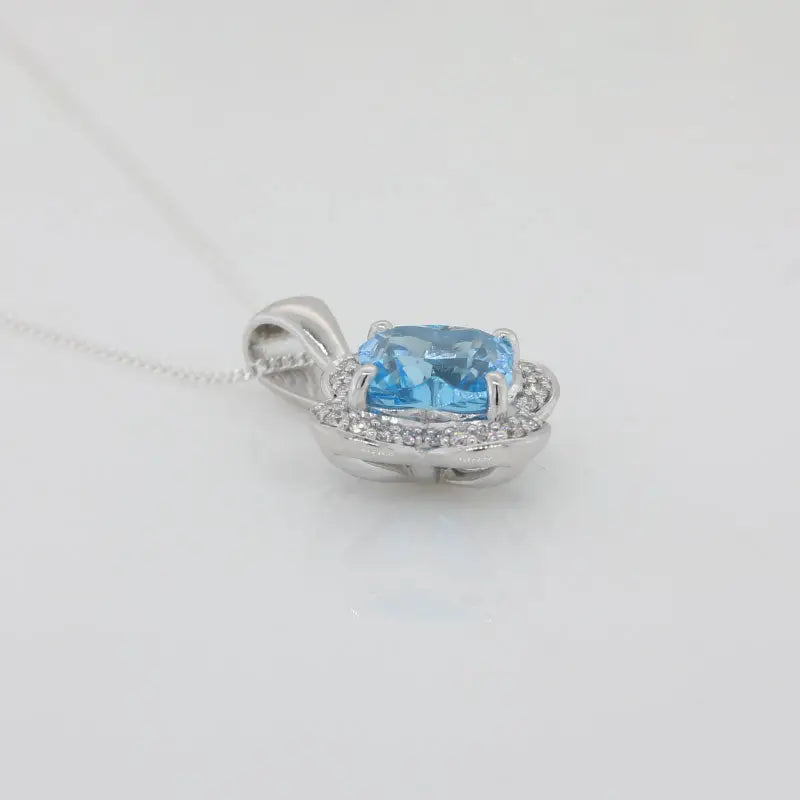 9 Carat White Gold Swiss Blue Topaz Flower Shape 7.3mm, Cabochon Top 1.99 Carat Diamond Halo Pendant