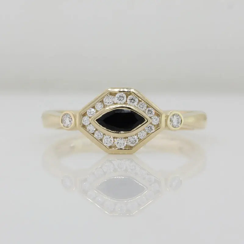 9 Carat Yellow Gold Marquise Sapphire in Diamond Halo Ring