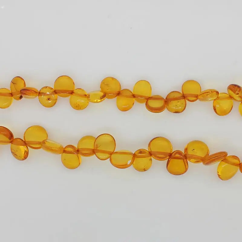 Baltic Amber Flat Oval Orange Beads Graduatng from 7.5mm