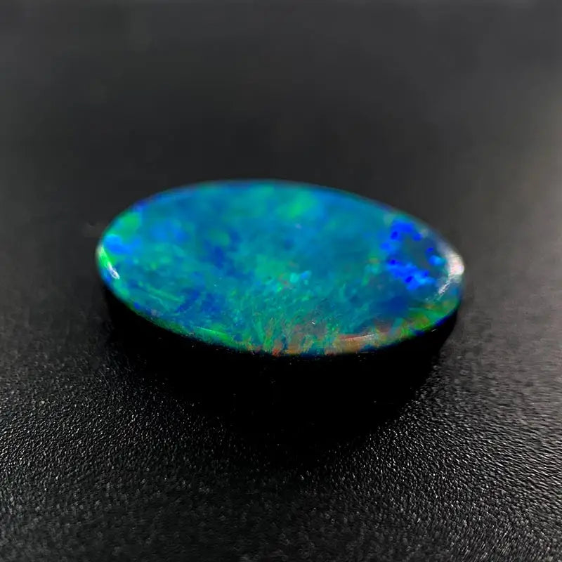 Opal Doublet Oval Shape Green, Blue, Orange Colours 13.19mm x 9.4mm x 2.8mm Deep
