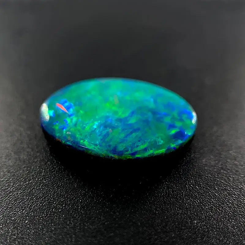 Opal Doublet Oval Shape Green, Blue, Orange Colours 13.19mm x 9.4mm x 2.8mm Deep