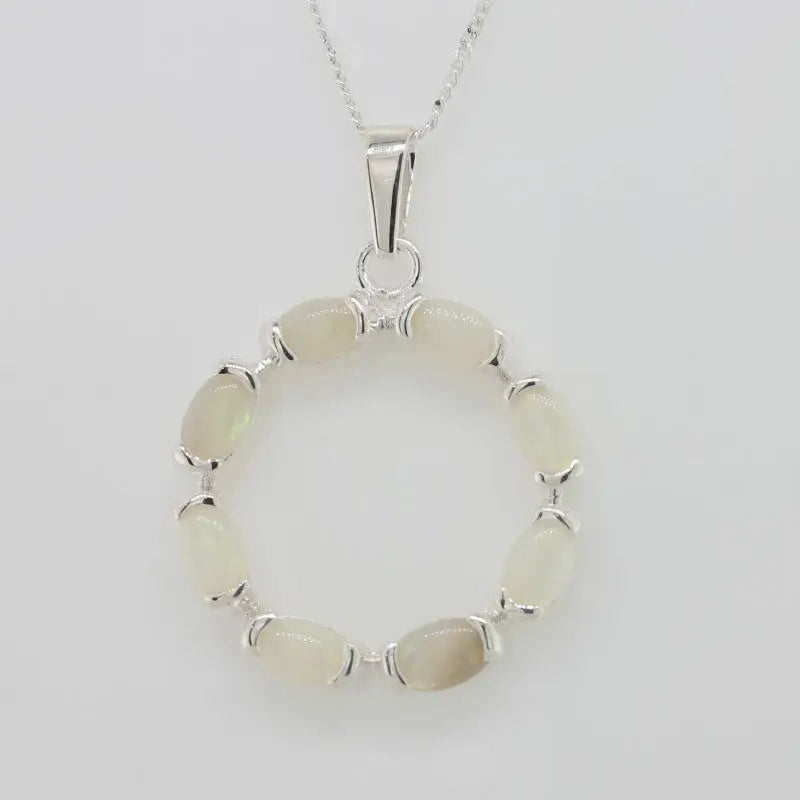 Sterling Silver Eight 5mm x 3mm Oval Solid Crystal Opals Set in a Circle Pendant